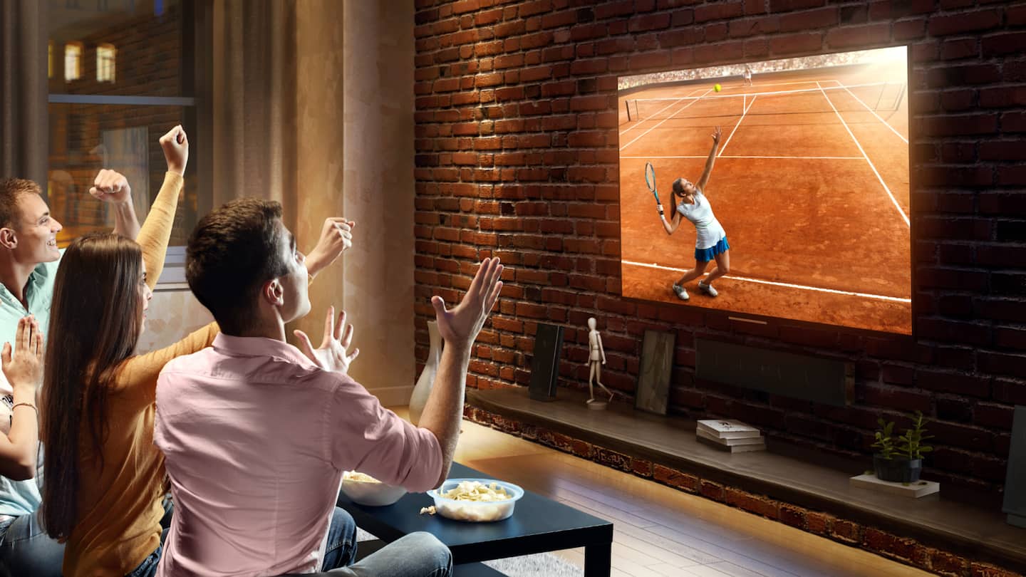 Image of a family watching a streamed sports event together in front of a large-screen television
